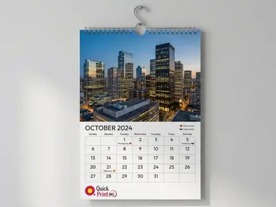 A3 wall calendar with wire-o binding hanging in an office, printed in Hyderabad