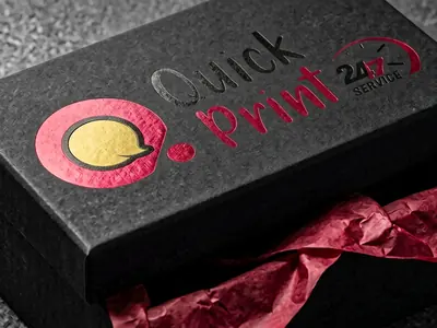 Premium rigid black gift box with foil-stamped logo and crimson tissue lining, custom packaging printed in Hyderabad by QuickPrintt
