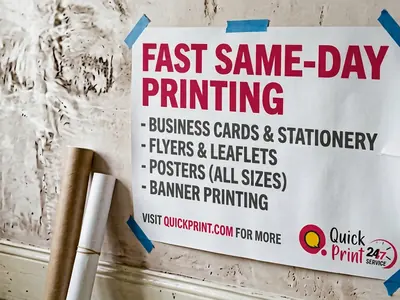 Large A1 promotional poster mounted on a wall with a rolled poster below, printed in Hyderabad