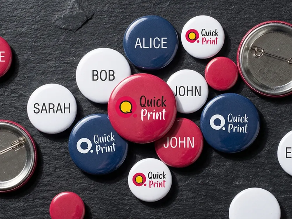 Round epoxy-domed button badges with pin backs, printed in Hyderabad